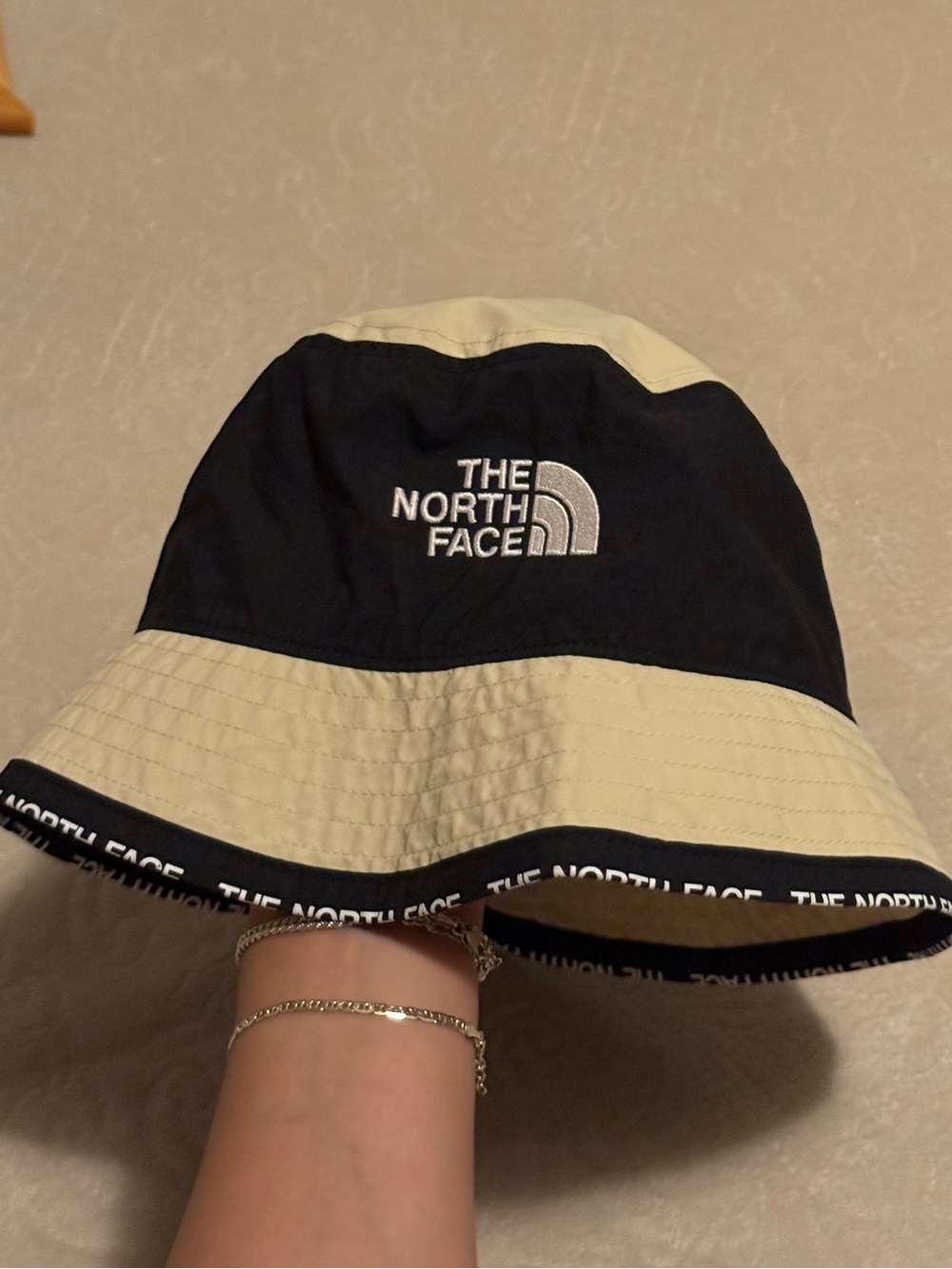 The North Face Two-Tone Black and Cream Bucket Hat